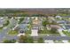 An aerial view showing the layout of the neighborhood and nearby trees at 2691 Hawthorne Ln, Kissimmee, FL 34743