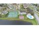 Aerial view of community amenities with a park, pool, tennis and basketball court at 2691 Hawthorne Ln, Kissimmee, FL 34743