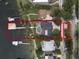 Aerial view of the property showcasing the house, pool, boat dock, and lush surroundings at 904 Main St, Windermere, FL 34786