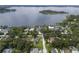 An aerial view of the community reveals the homes nestled along a beautiful lake at 904 Main St, Windermere, FL 34786