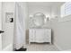 Bathroom with marble vanity, and shower featuring stylish tiling at 904 Main St, Windermere, FL 34786