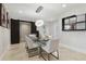 Dining room featuring modern lighting, neutral paint and decor, and a glass table with seating for six at 904 Main St, Windermere, FL 34786