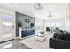 Modern living room with sleek furniture, decorative wall, and waterfront views through large sliding doors at 904 Main St, Windermere, FL 34786