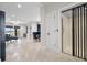 Elegant living space with modern elevator access; neutral tones, and travertine flooring at 904 Main St, Windermere, FL 34786