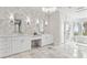 Elegant bathroom featuring marble floors, dual sinks, and modern fixtures at 904 Main St, Windermere, FL 34786