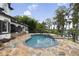 Enjoy a backyard retreat with private pool and stone patio for ultimate relaxation at 904 Main St, Windermere, FL 34786