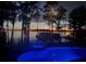 Heated pool and spa overlooking a lake with sunset views; ideal for relaxation and entertainment at 904 Main St, Windermere, FL 34786