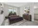 Cozy bedroom featuring soft carpet, two windows, and a stylish dresser with decor at 487 Toscano St, Clermont, FL 34715