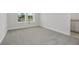 Bright bedroom with neutral carpet, base trim and natural light at 487 Toscano St, Clermont, FL 34715