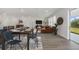 Inviting living room and dining area with modern decor and lots of natural light at 487 Toscano St, Clermont, FL 34715
