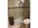 Bathroom showing tiled shower with frameless glass door and built-in bench at 588 Orange Dr # 131, Altamonte Springs, FL 32701