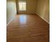 Bright, sunny, and spacious bedroom features wood-look flooring at 588 Orange Dr # 131, Altamonte Springs, FL 32701