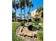 Exterior image of manicured landscaping with a fountain near the pool and lake at 588 Orange Dr # 131, Altamonte Springs, FL 32701