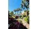Exterior shot of manicured landscaping near the pool and lake at Sandy Cove at 588 Orange Dr # 131, Altamonte Springs, FL 32701