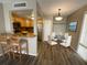 Open concept dining area is adjacent to the kitchen and features wood-look floors at 588 Orange Dr # 131, Altamonte Springs, FL 32701
