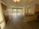 Open concept living room with view of patio and kitchen bar at 588 Orange Dr # 131, Altamonte Springs, FL 32701