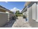 Stone patio with seating and greenery at 900 Sussex Close, Orlando, FL 32804