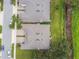 An aerial view of the rooftops of homes, showing their layout and proximity to a grassy area at 1862 Overcup Ave, Saint Cloud, FL 34771