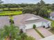 Aerial view of the home featuring a lush lawn and landscaping with pond view at 1862 Overcup Ave, Saint Cloud, FL 34771