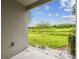 View from back porch featuring a spacious lush lawn with a verdant greenbelt view at 1862 Overcup Ave, Saint Cloud, FL 34771