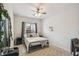 Cozy bedroom featuring a ceiling fan, area rug, and a bright window at 1862 Overcup Ave, Saint Cloud, FL 34771