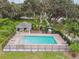 The community pool features a cabana, patio seating and mature shade trees at 1862 Overcup Ave, Saint Cloud, FL 34771