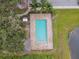 Aerial view of the community pool with lounge chairs and adjacent covered lounge area at 1862 Overcup Ave, Saint Cloud, FL 34771