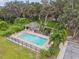 The community pool features a cabana, patio seating and mature shade trees at 1862 Overcup Ave, Saint Cloud, FL 34771