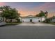 Street view featuring a villa with a two-car garage and well-kept landscaping, radiating suburban allure at 1862 Overcup Ave, Saint Cloud, FL 34771