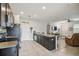 Open kitchen view, showcasing a large granite island connecting to the living area at 1862 Overcup Ave, Saint Cloud, FL 34771