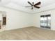 Bright bedroom with neutral carpet and sliding glass doors to a screened porch with scenic views at 14126 Fox Glove St, Winter Garden, FL 34787