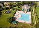 A large community pool features a water fountain and is adjacent to a playground at 14126 Fox Glove St, Winter Garden, FL 34787
