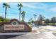 Entrance to Stoneybrook West Golf Club lined with palm trees and beautiful landscaping at 14126 Fox Glove St, Winter Garden, FL 34787
