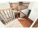 Grand home foyer featuring hardwood and carpeted stairs, as well as a beautiful wooden banister at 14126 Fox Glove St, Winter Garden, FL 34787