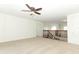 Spacious loft area with neutral carpet, ceiling fan, and view of the home's staircase at 14126 Fox Glove St, Winter Garden, FL 34787
