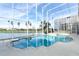 Enclosed pool area with a lake view and palm trees outside at 14126 Fox Glove St, Winter Garden, FL 34787