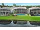 Aerial view of the back of the home with a screened-in pool and lush green lawn at 14126 Fox Glove St, Winter Garden, FL 34787