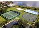 Aerial view of community sports courts: tennis, beach volleyball, basketball, and ice hockey at 14126 Fox Glove St, Winter Garden, FL 34787
