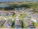 Aerial view shows home with green lawn in cul-de-sac with outlined property and neighboring homes at 16033 Barkly Ridge Ct, Winter Garden, FL 34787
