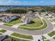 Aerial view of single-Gathering home with lush lawn, lake views, and neighborhood playground at 16033 Barkly Ridge Ct, Winter Garden, FL 34787