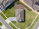 An aerial view showcases a home with green lawn, a driveway, and manicured landscaping at 16033 Barkly Ridge Ct, Winter Garden, FL 34787
