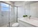Bathroom featuring glass shower doors, marble tile, and white quartz countertop at 16033 Barkly Ridge Ct, Winter Garden, FL 34787