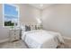 Inviting bedroom with a comfortable bed, side tables, and a window offering natural light and a pleasant view at 16033 Barkly Ridge Ct, Winter Garden, FL 34787