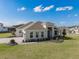 Attractive single-story home featuring a paved driveway, manicured lawn, and pristine landscaping at 16033 Barkly Ridge Ct, Winter Garden, FL 34787