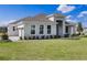 A beautifully landscaped single-story home with a two car garage and a spacious front lawn at 16033 Barkly Ridge Ct, Winter Garden, FL 34787