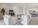 Open-concept living space with modern furnishings, a cozy rug, and seamless connection to the adjacent kitchen area at 16033 Barkly Ridge Ct, Winter Garden, FL 34787