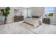 Serene main bedroom features a plush bed, neutral tones, and a decorative rug for a relaxing retreat at 16033 Barkly Ridge Ct, Winter Garden, FL 34787
