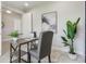 Well-lit office showcases a modern desk, chair, and artwork, providing a comfortable and inspiring workspace at 16033 Barkly Ridge Ct, Winter Garden, FL 34787