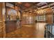 Exquisite bar area with beautiful wood finishes, stained glass, and custom details at 6324 Deacon Cir, Windermere, FL 34786