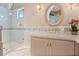 Charming bathroom featuring a glass shower, custom vanity, and decorative accents at 6324 Deacon Cir, Windermere, FL 34786